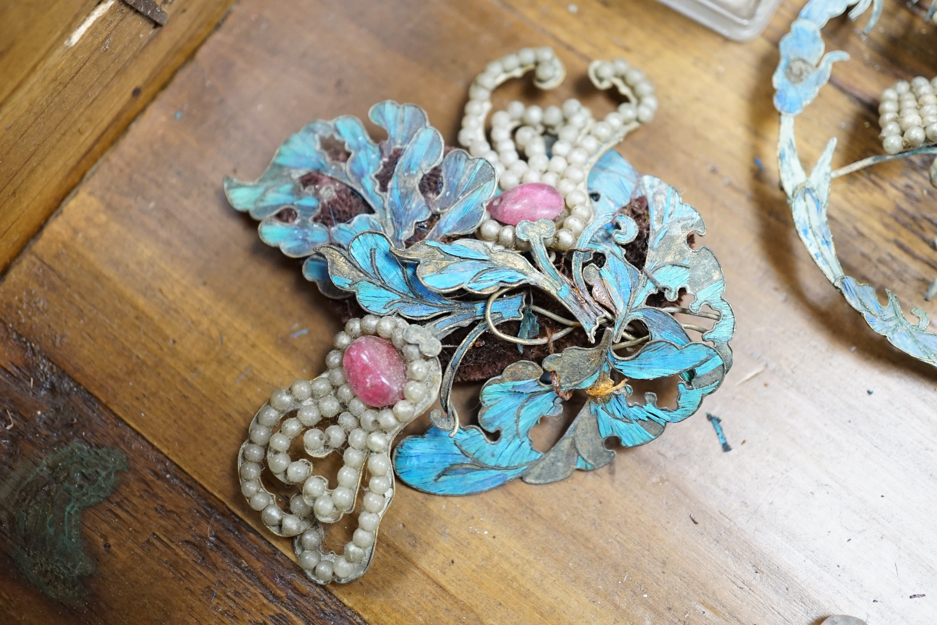 A group of eight Chinese kingfisher feather, jade, seed pearl, coral and hardstone mounted headdresses and ornaments, late Qing dynasty, some losses